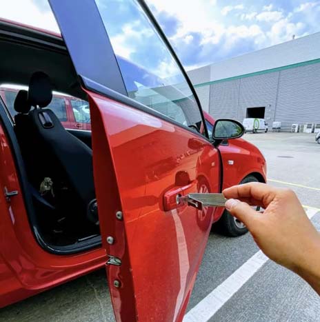 emergency locksmith opening a car door