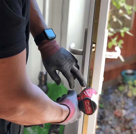 locksmith carrying out a lock repair